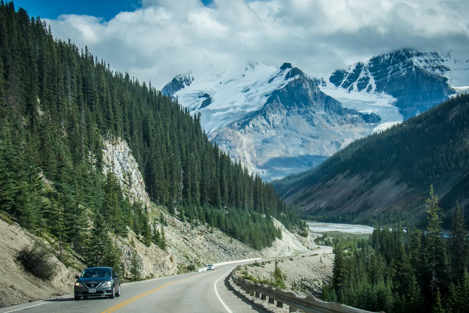 The Icefields Parkway leading toward peaks in the Canadian Rockies